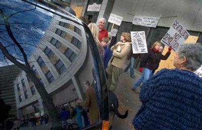 
Protestors concerned about the demolition of the Rookery building in downtown Spokane gather for a noon protest Saturday. About 100 people equipped with signs, stickers and protest chants walked the block to bring attention to the historic building that is due to be demolished next week. 
 (Christopher Anderson/ / The Spokesman-Review)