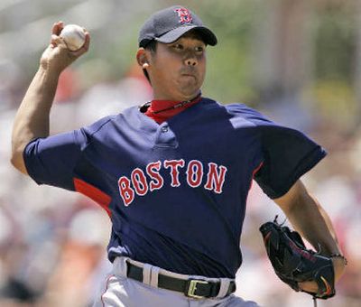 Boston Red Sox addition Daisuke Matsuzaka went 17-5 with 200 strikeouts in Japan last season.
(Associated Press / The Spokesman-Review)