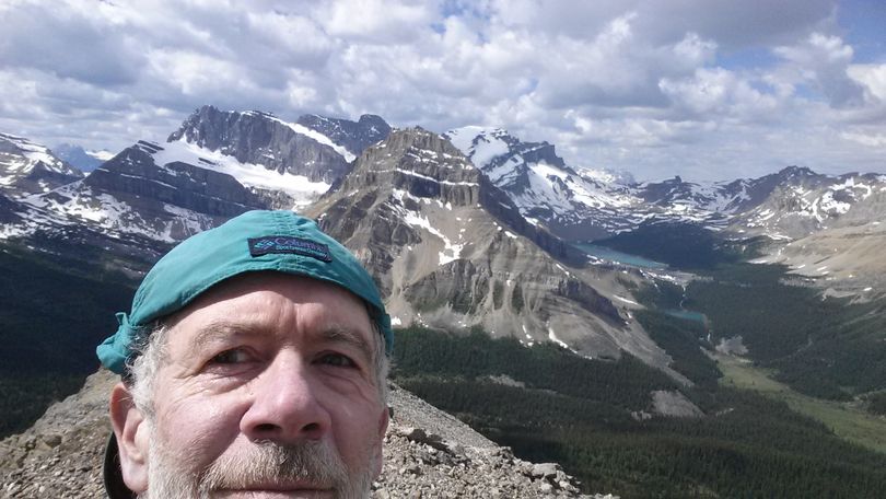 Rich Landers sharing the view from the top of Skoki Peak in Canada's Banff National Park. (Rich Landers)