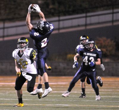Mt. Spokane’s Chase Naccarato catches a fourth-down pass for a first down. (Jesse Tinsley)