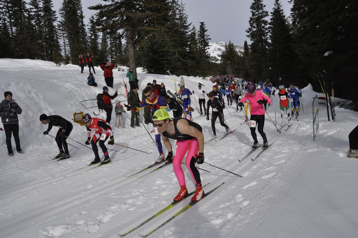 Brett Ford (yellow cap) starts just ahead of Rebecca Dussault (211) in the Spokane Langlauf 10-kilometer cross-country ski race at Mount Spokane. Ford was the overall winner and Dussault, a 2006 Olympian, topped the women