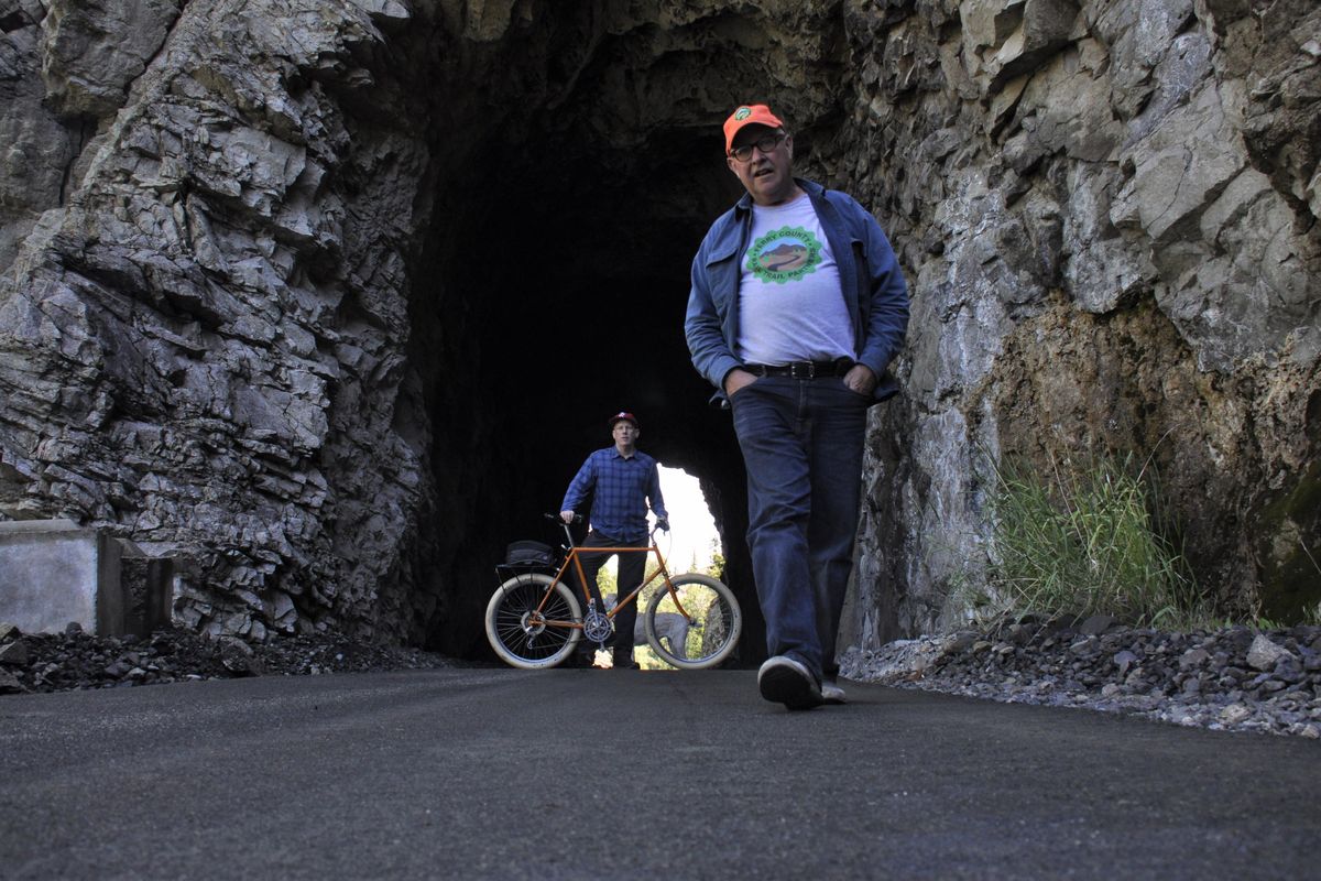 Keith Bell, right, and Bobby Whittaker check out a new smooth surface he’s packing on the Ferry County Rail Trail. (Rich Landers / The Spokesman-Review)