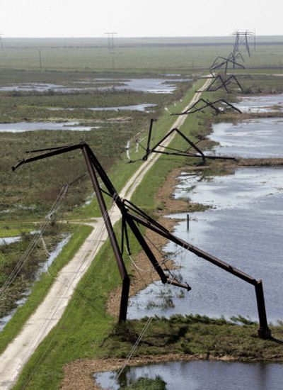 
Crumpled towers carrying transmission lines stretch for miles in Palm Beach County, Fla., Wednesday. About 6 million customers of Florida Power & Light lost power because of Hurricane Wilma. 
 (Associated Press / The Spokesman-Review)