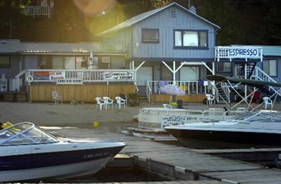 
Shore Acres Resort appears to glow at sunset Tuesday afternoon on Loon Lake. The resort is for sale for about $1.4 million. 
 (Jed Conklin / The Spokesman-Review)