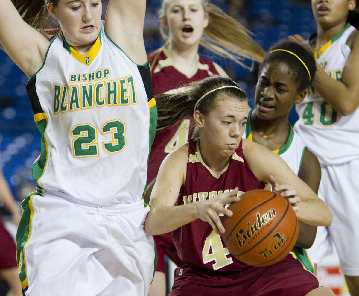 University’s Emma Kennedy, middle, battles Bishop Blanchet players for a rebound during U-Hi’s 50-45 quarterfinal loss. (Patrick Hagerty)