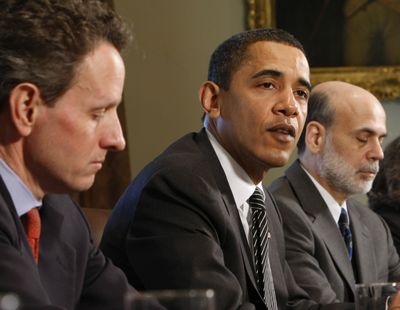 President Barack Obama, flanked by Treasury Secretary Timothy Geithner, left, and Federal Reserve Chairman Ben Bernanke, receives a briefing Mondayin the White House. The president on Monday unveiled his program to help banks struggling with bad mortgages.  (Associated Press / The Spokesman-Review)