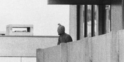 
A member of the Palestinian commando group is seen on the balcony of the Israeli Olympic team quarters on Sept. 5, 1972 in Munich, Germany, where they held several Israeli athletes hostage.
 (Associated Press / The Spokesman-Review)