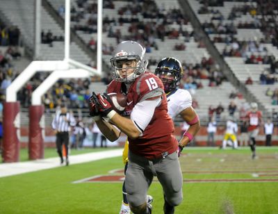 Washington State’s Brett Bartolone hauls in a touchdown catch against California in 2012 in Pullman.  (Tyler Tjomsland/The Spokesman-Review)