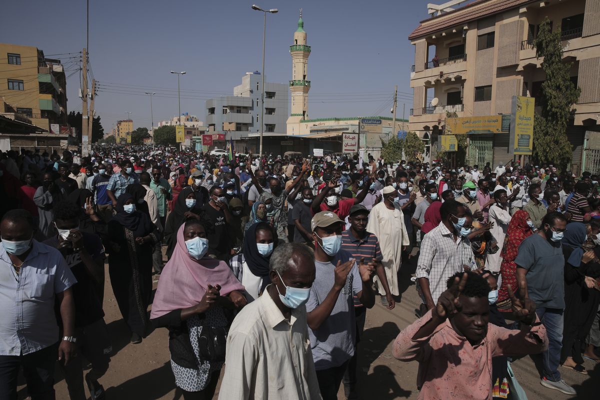People protest in Khartoum, Sudan, Saturday, Nov. 13, 2021. Pro-democracy protesters took to the streets across Sudan to rally against the military
