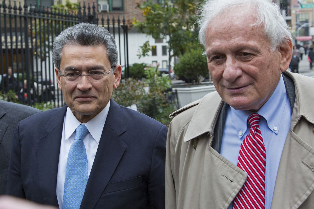 Former Goldman Sachs and Procter & Gamble Co. board member Rajat Gupta, center, arrives outside federal court in New York Wednesday, Oct. 24, 2012. Gupta is to be sentenced after being found guilty insider trading by passing secrets between March 2007 and January 2009 to a billionaire hedge fund founder who used the information to make millions of dollars. At right is Gupta