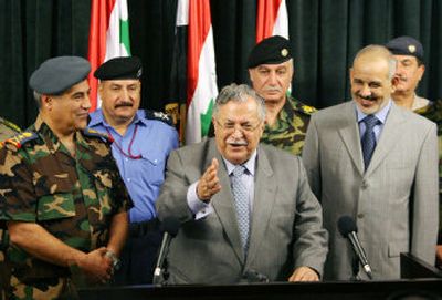 
Flanked by Iraq's Deputy Commander of the Armed Forces Lt. Gen. Nasir al-Abadi, left, and Interior Minister Jawad al-Bolani, President Jalal Talabani says he remains optimistic about security plans for the country on Wednesday in the fortified Green Zone area of Baghdad, Iraq. 
 (Associated Press / The Spokesman-Review)