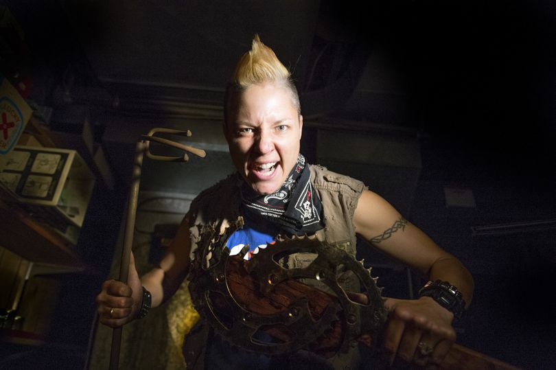 “Z Nation” prop maker Kalise Wallace holds an aged coal furnace grabbing tool, at left, salvaged from Doug Clark’s childhood home. She also brandishes “The Spokesman,” a menacing mace she made out of sharpened and welded motorcycle sprockets. The show named the weapon in honor of Spokane and the newspaper. (Colin Mulvany)