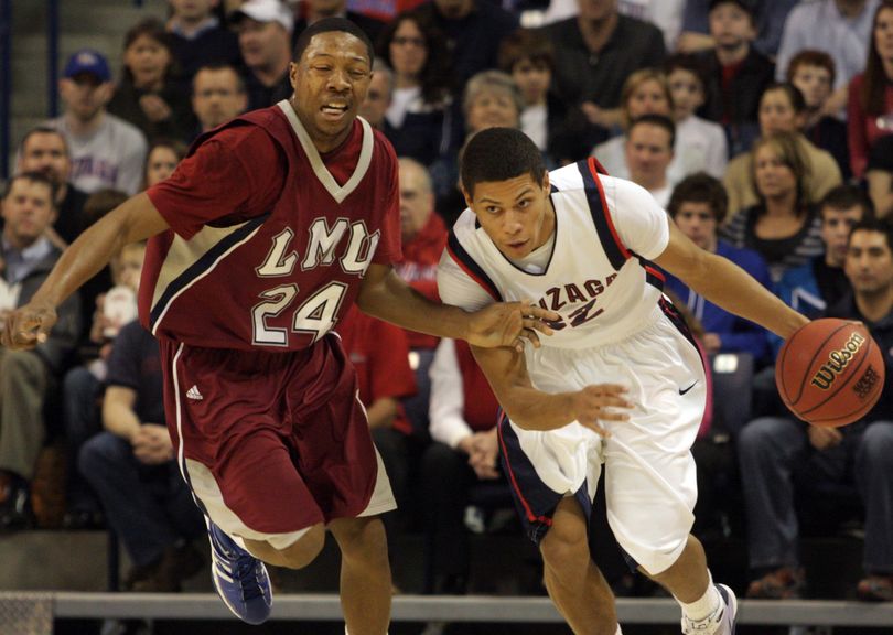 Gonzaga's Steven Gray drives against Loyola Marymount's LaRon Armstead. (Rajah Bose / Associated Press)