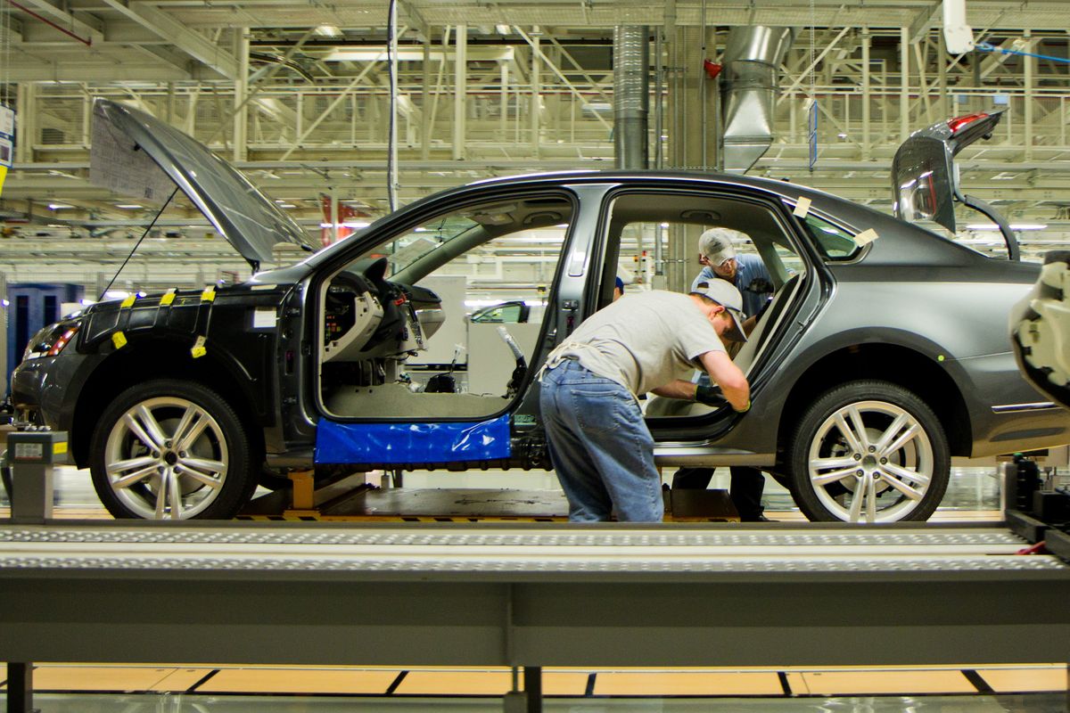 Workers assemble a Passat sedan at Volkswagen AG’s plant in Chattanooga, Tenn., on March 22. (Associated Press)