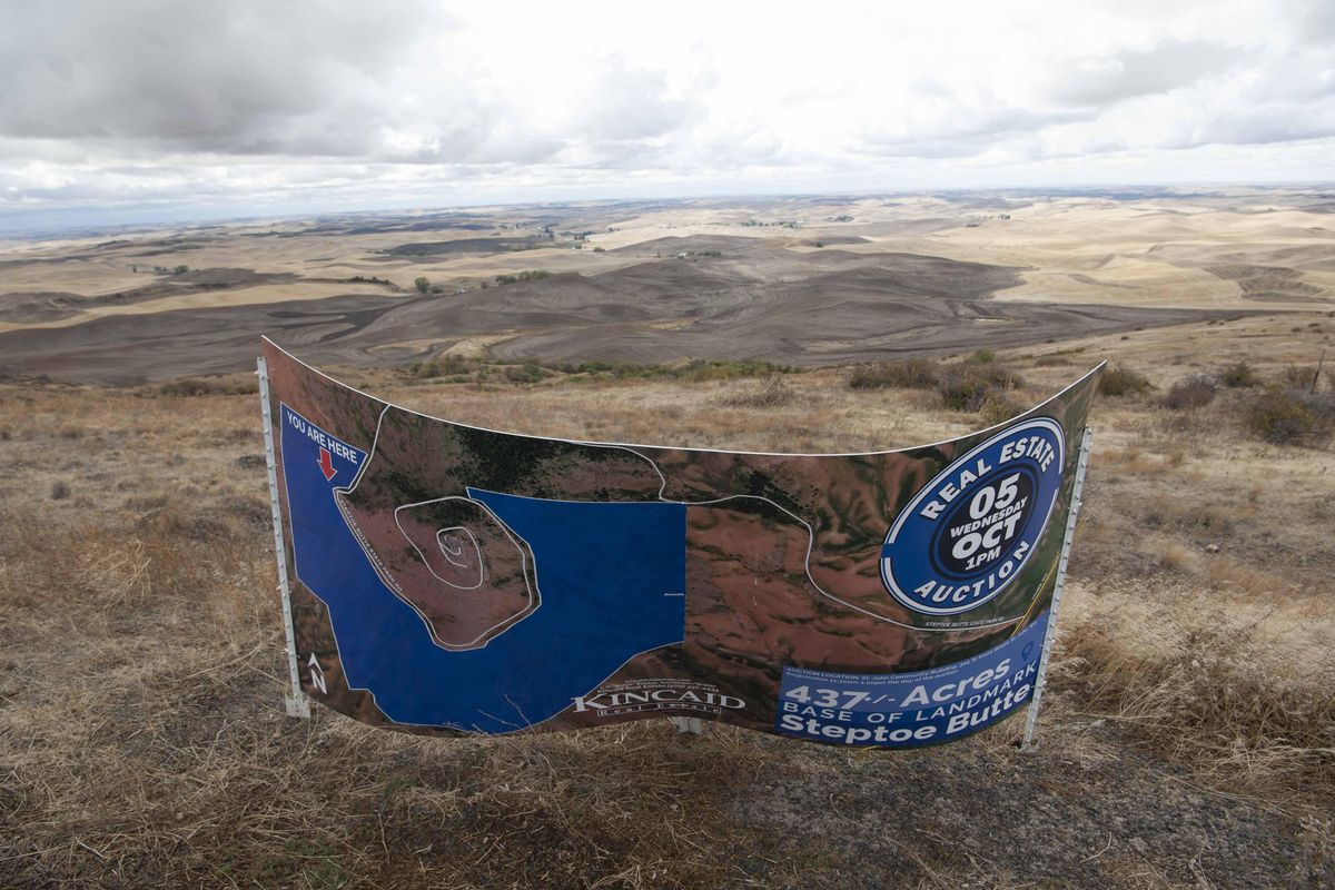 A sign for Kincaid Auctions is seen at Steptoe Butte on Friday, Oct. 7, 2016, near Colfax. (Tyler Tjomsland / The Spokesman-Review)