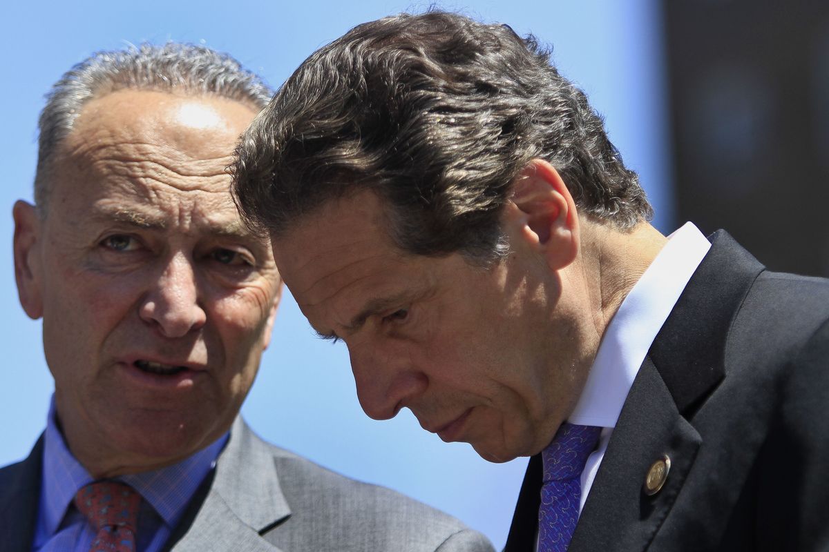 FILE - In this June 2, 2014, file photo, U.S. Sen. Charles Schumer, left, D-N.Y., speaks with New York Gov. Andrew Cuomo, right, during a press conference in New York. New York Gov. Andrew Cuomo has avoided public appearances for days as some members of his own party call for him to resign over sexual harassment allegations.  (Bebeto Matthews)