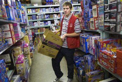 
Central Valley High School junior Bob Plumb, 16, stocks shelves at a White Elephant store  in Spokane on Tuesday. Plumb has lost 183 pounds since having his stomach banded last year. He has taken up loom knitting to keep his hands busy and away from the refrigerator door. 
 (Holly Pickett / The Spokesman-Review)