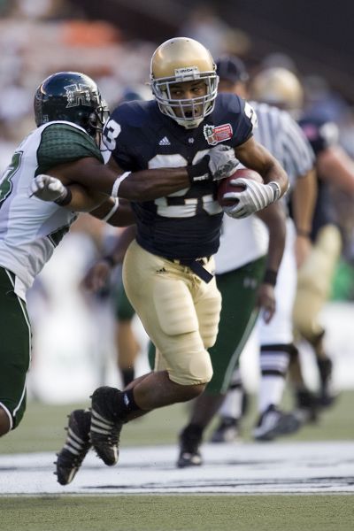 Notre Dame wide receiver Golden Tate, right, breaks a tackle by Hawaii’s Calvin Roberts during Notre Dame’s  49-21 victory Wednesday in the Hawaii Bowl.  (Associated Press / The Spokesman-Review)