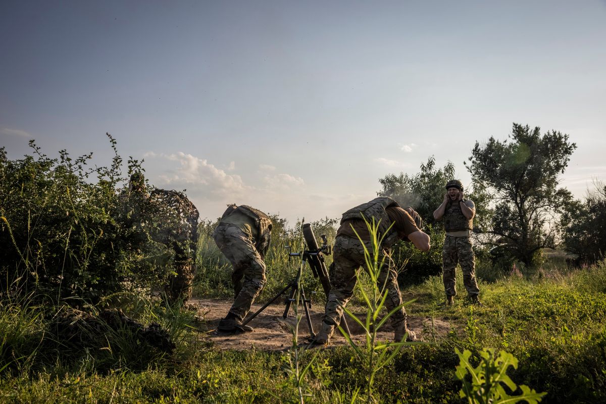 Soldiers from the 3rd Assault Brigade prepare to fire mortar rounds at a base between Klishchiivka and Kostyantynivka on Wednesday. MUST CREDIT: Photo for The Washington Post by Ed Ram  (Ed Ram/For The Washington Post)