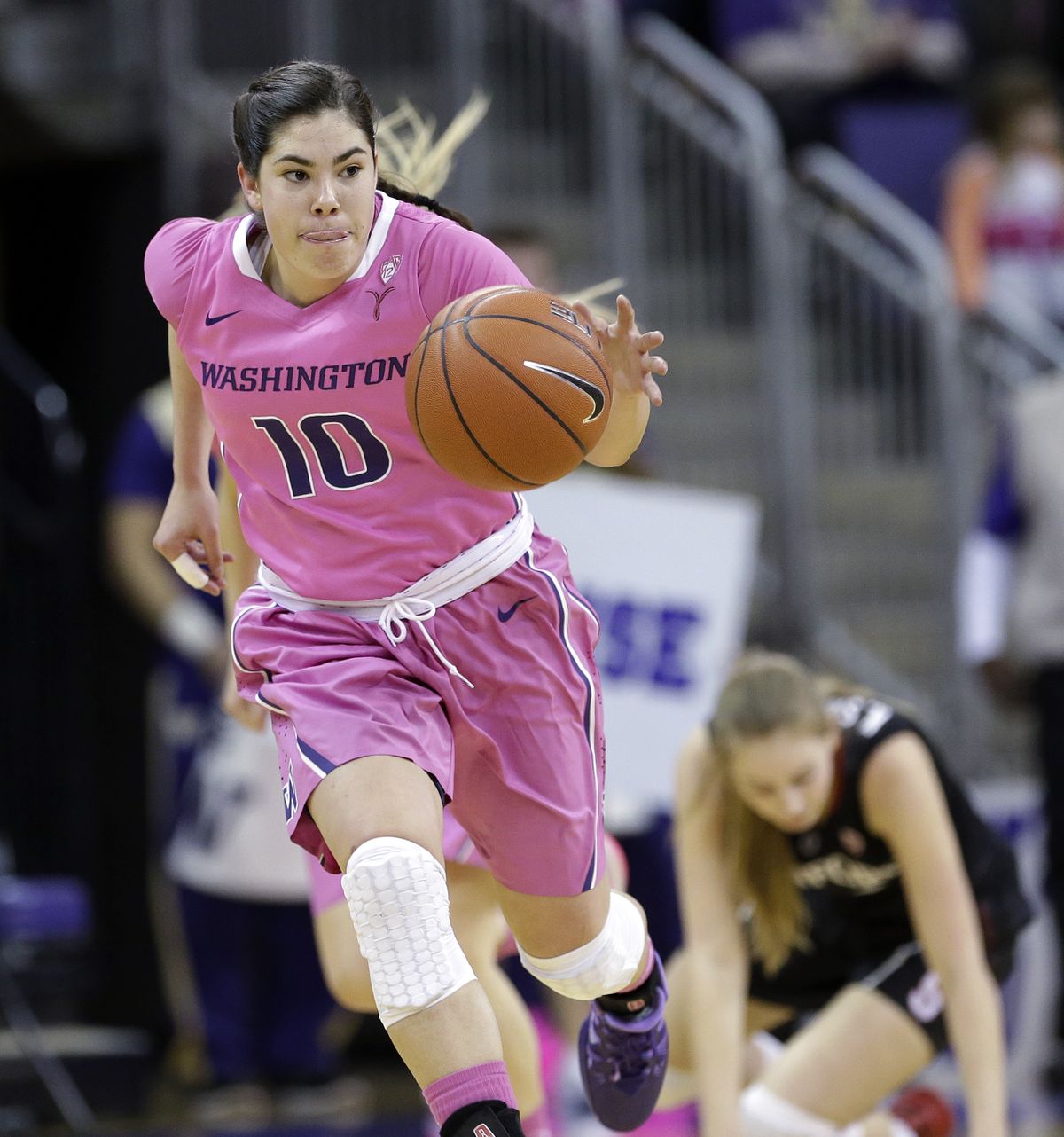 Kelsey Plum, who led UW 23 points, races up court against Stanford during Sunday’s game in Seattle. (Associated Press)