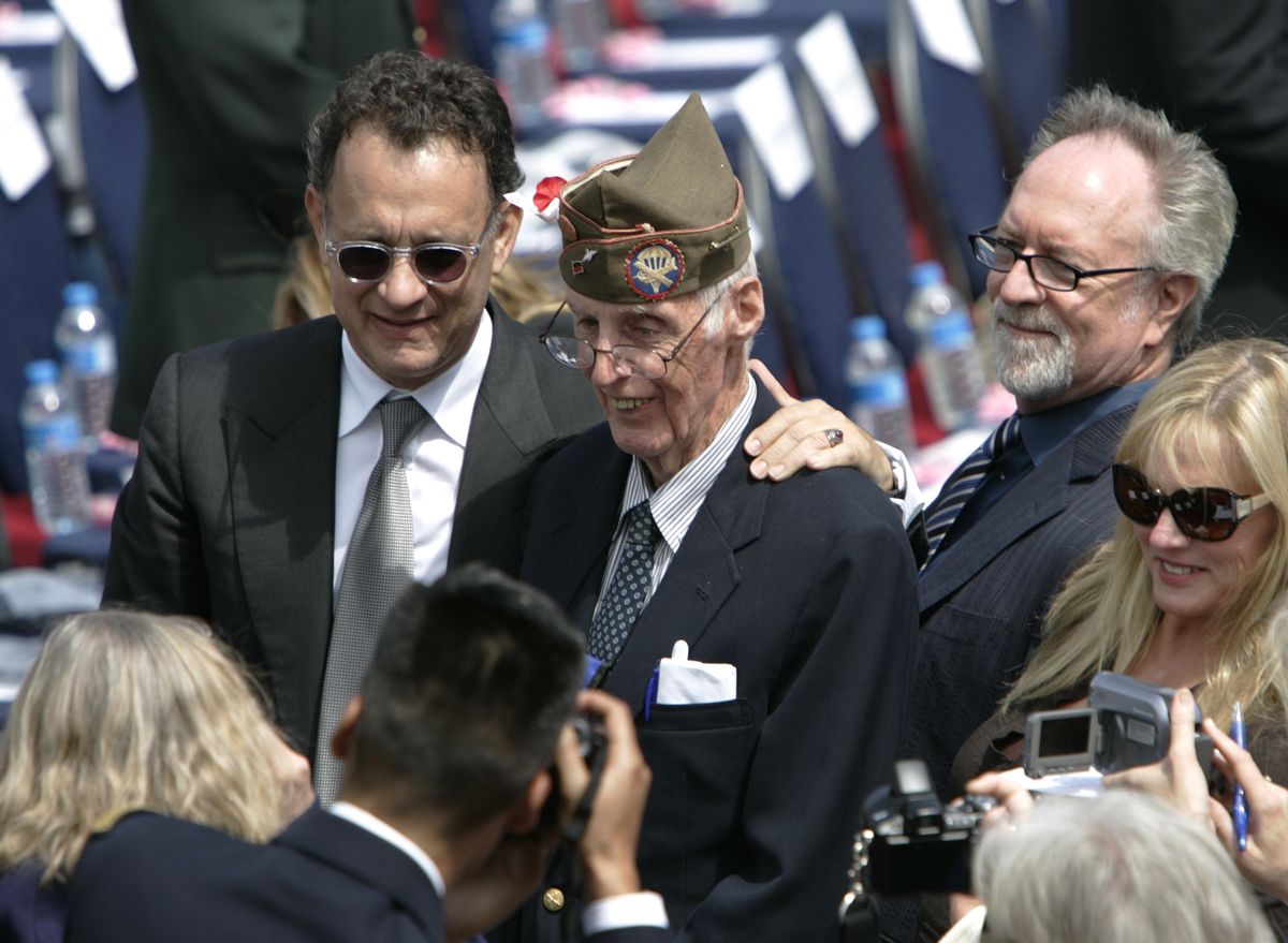 Movie star Tom Hanks, left, poses with U.S. veteran William F. Edwars, center, prior to a ceremony Saturday in Normandy commemorating D-Day.  (Associated Press / The Spokesman-Review)