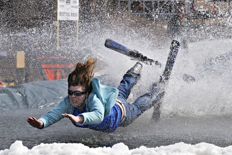 In this March 21, 2010 photo, Avery Smith, 23, of White River Junction, Vt., makes her first attempt at pond skimming during the the fourth annual end of season Junk Show at Whaleback Mountain in Enfield, N.H. (Jason Johns / Valley News)