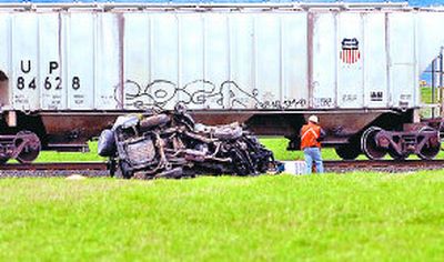 
Spirit Lake City Councilman Steve Gaddum was killed Thursday after his  SUV collided with a train past the intersection of Lancaster Avenue and Meyer  Road. 
 (Kathy Plonka / The Spokesman-Review)