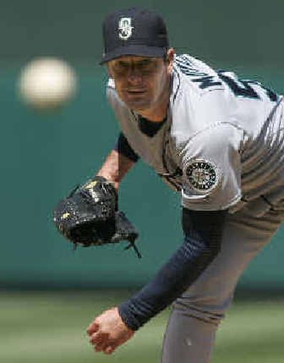 
Seattle starter Jamie Moyer, who improved to 3-0, throws in the fourth inning against the Los Angeles Angels on Tuesday afternoon. 
 (Associated Press / The Spokesman-Review)