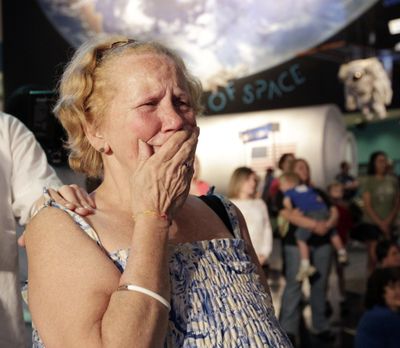 Diane Breener, of Houston, reacts Tuesday as NASA announces the museums that will receive space shuttles, and Houston was not on the list. (Associated Press)
