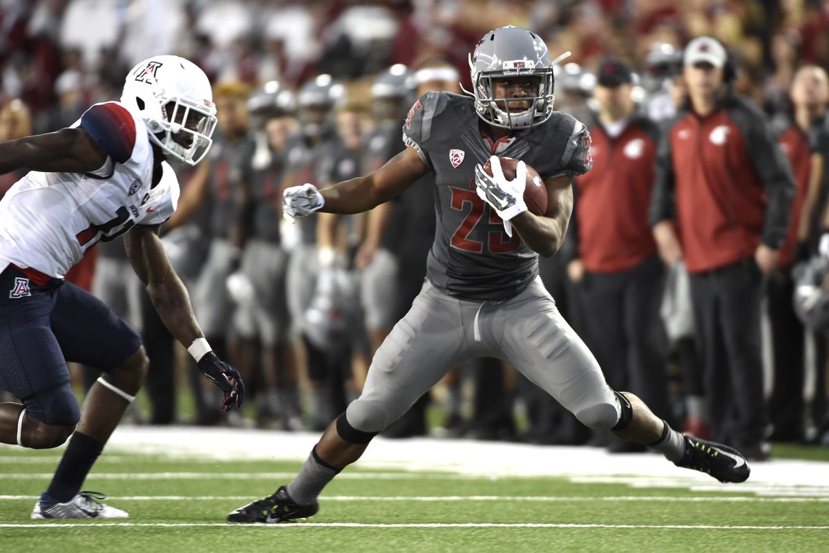 WSU running back Jamal Morrow has been known to slip a tackle or two with ball in hand. (Tyler Tjomsland)