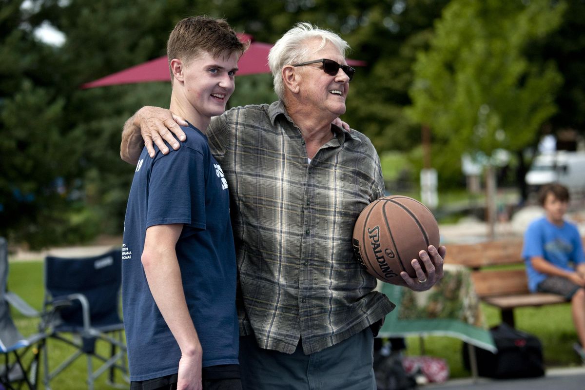 "He looks out for other people and that's awesome," said Pete Peterson about his grandson Jacob Peterson,17, during the "Kix For Kids" fundraiser at McEuen Park in Coeur d'Alene on Saturday, Aug. 24, 2019. Jacob thought of the fundraiser after seeing a child who had worn out shoes. He'll play anyone who desires a pick up game and wants to help local kids whose families can't afford new shoes. The loser donates $5.00 to the "Kix For Kids" cause. (Kathy Plonka / The Spokesman-Review)