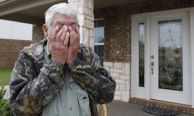 Wilburn C. Russell wipes his eyes after talking to reporters Tuesday in front of the house his son, U.S. Army Sgt. John Russell, in Sherman, Texas.  (Associated Press / The Spokesman-Review)