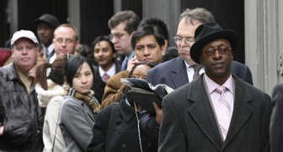 People line up to attend a job fair last month in New York. The Labor Department has reported rising unemployment. Associated Press
(Associated Press / The Spokesman-Review)