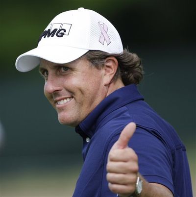 This is a June 20, 2009 file photo showing Phil Mickelson giving the gallery a thumbs up during the second round of the U.S. Open Golf Championship at Bethpage State Park's Black Course in Farmingdale, N.Y. Mickelson is returning to the PGA Tour, deciding to play the Bridgestone Invitational next week, his first tournament since the U.S. Open.  (Mike Groll / AP Photographer)