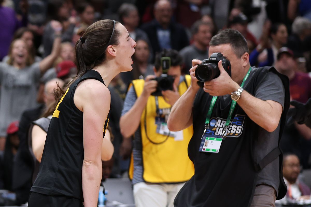 Iowa’s Caitlin Clark reacts after scoring 41 points Friday in a 77-73 win over South Carolina during the Final Four in Dallas.  (Tribune News Service)