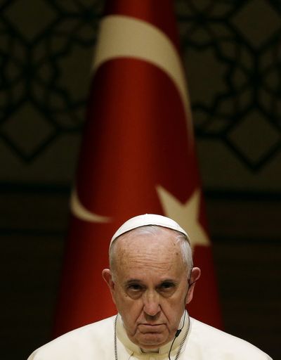 Pope Francis listens to Turkish President Recep Tayyip Erdogan's speech at the presidential palace on Friday. (Associated Press)