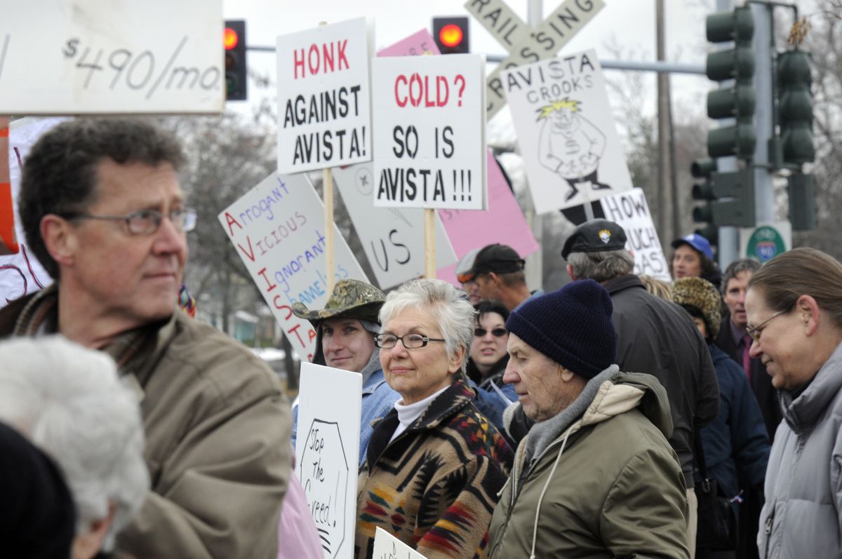 Protesters gather on the sidewalk outside the Avista headquarters on Mission Ave. in Spokane on Saturday to demonstrate against high power bills.  (Photos by Dan Pelle / The Spokesman-Review)