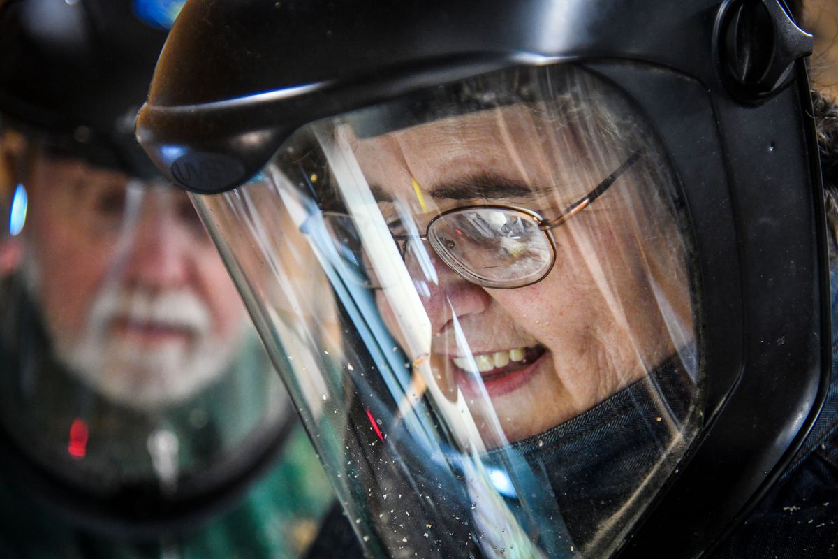 U.S. Army veteran Tzena Scarborough, right, focuses all her attention on a practice piece of wood as she learns under the guidance of Inland Northwest Woodturners President Doug Eaton, Tuesday, May 5, 2021, at the Vets Garage in Spokane.  (Dan Pelle/THE SPOKESMAN-REVIEW)