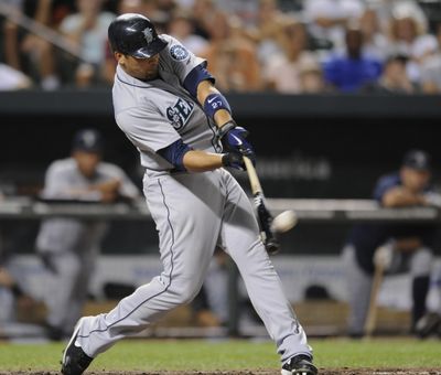 M’s Matt Tuiasosopo drills three-run home run in ninth. (Associated Press)