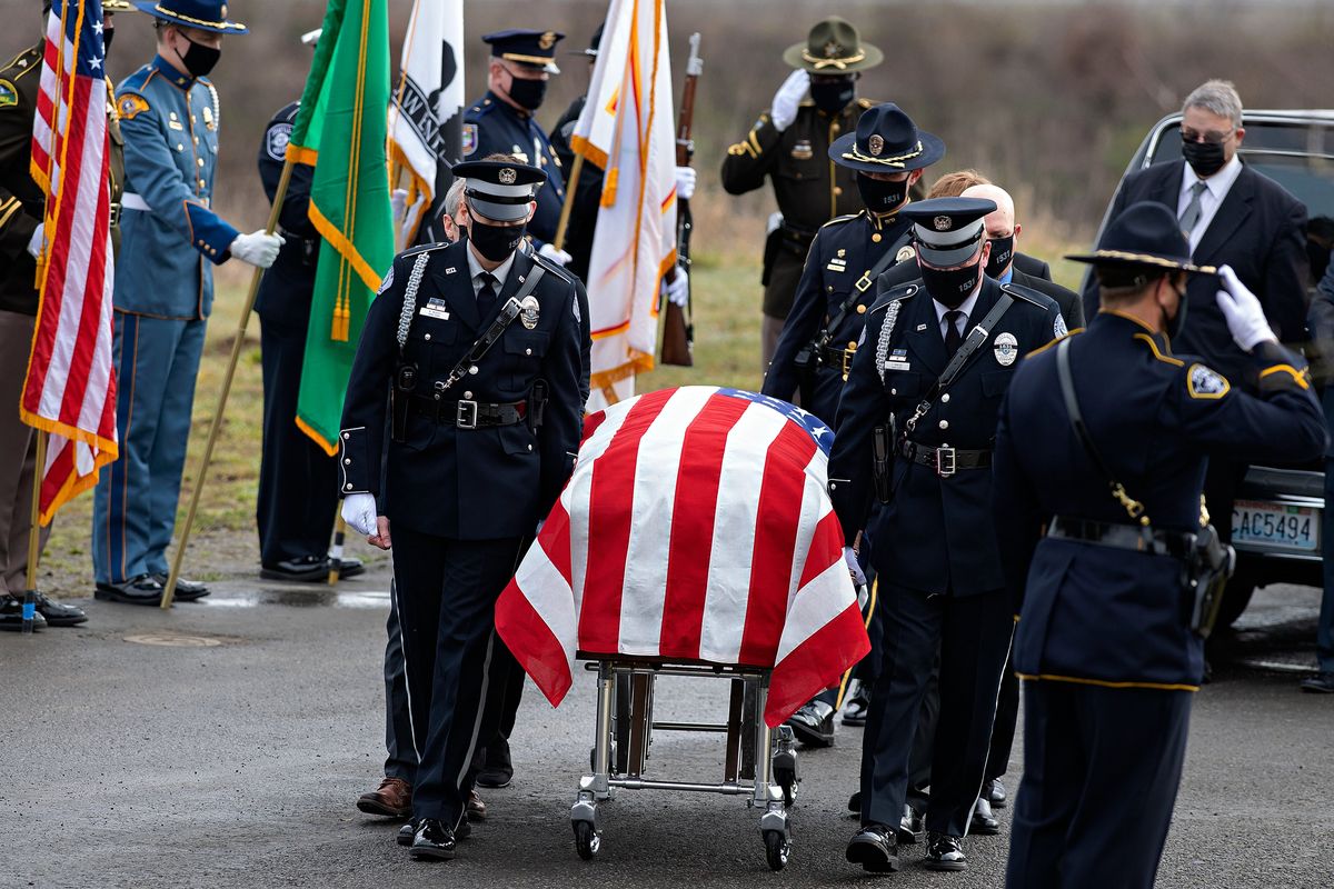 Officer Donald Sahota is honored by friends, family and colleagues at ilani Casino Resort near La Center, Wash., on Tuesday. Sahota, 52, was mistakenly shot at his home near Battle Ground by a Clark County sheriff during a manhunt for a robbery suspect.  (Associated Press)