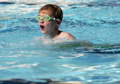 
Mathew Manza takes a breath before submerging during the Level II swimming lesson at Terrace View Park pool. Swimming lessons are just one of the Parks and Recreation prgrams available this summer. 
 (Liz Kishimoto / The Spokesman-Review)