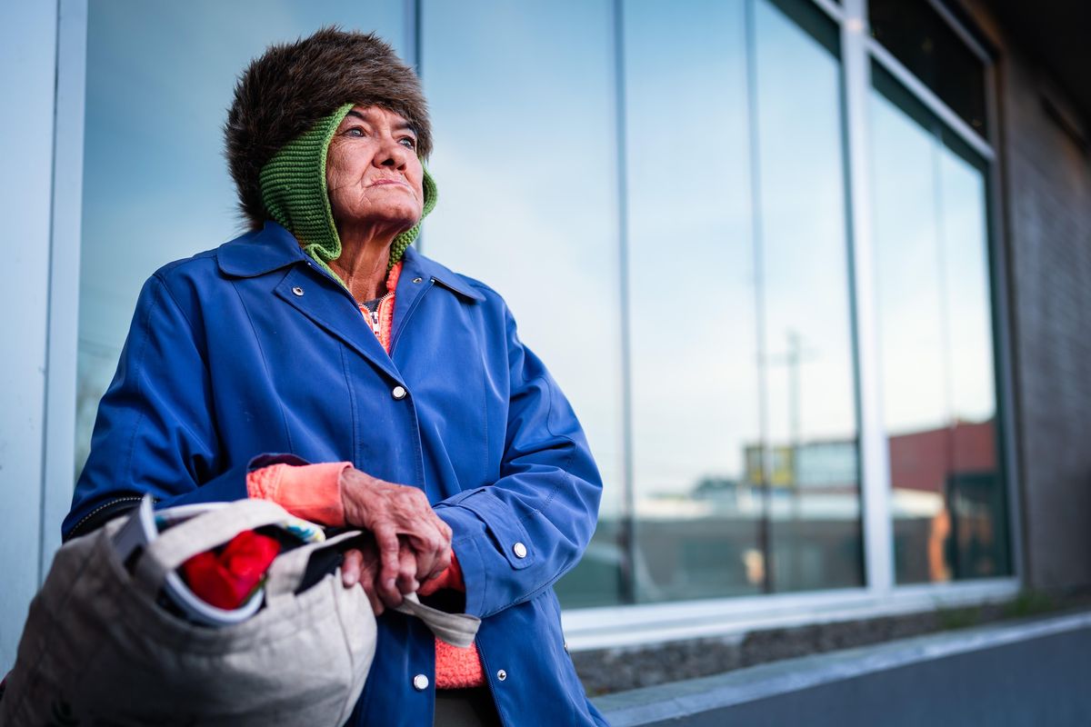 Homeless Gale Wagner, 66, waits outside Donna Hanson Haven to secure a bed for the night in the building’s shelter room for woman, Mon., April 13, 2020. Wagner says she is not seeing many people on the street who are sick and is not worried about the virus. (Colin Mulvany / The Spokesman-Review)