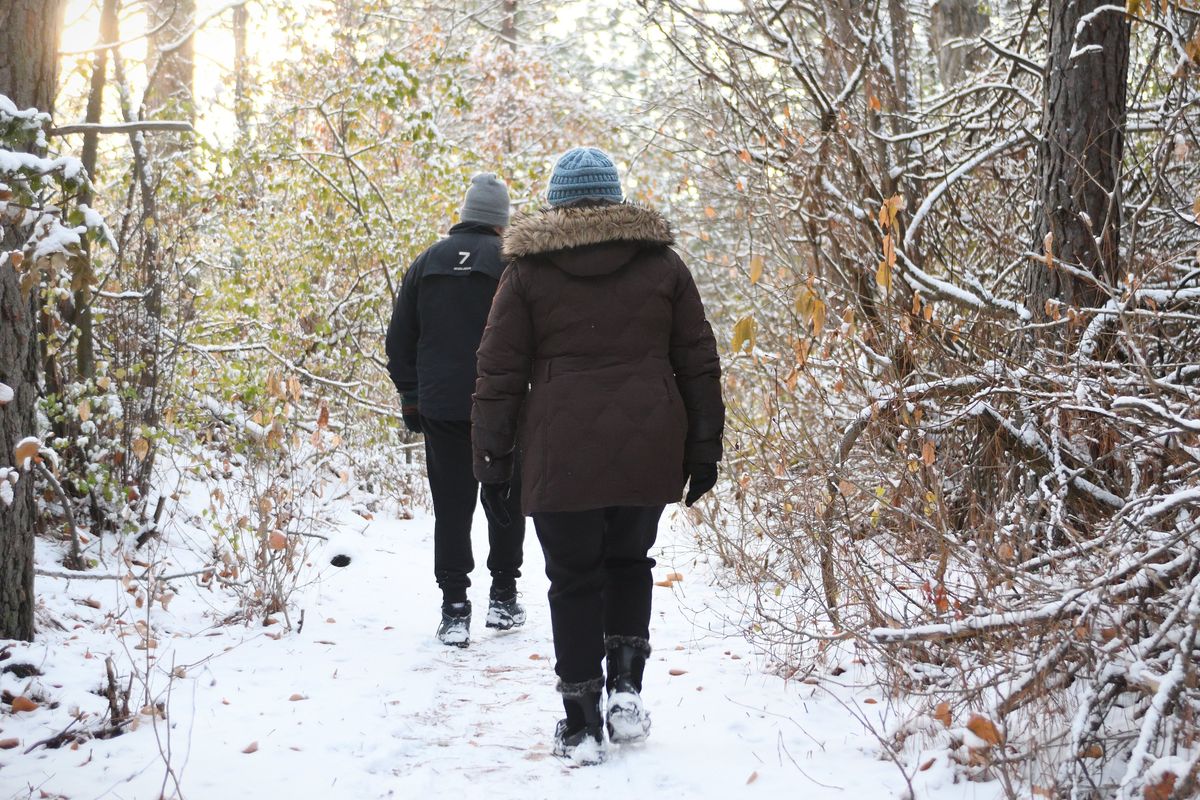 Molly and Adam Marshall walk along the Trolley Trail on Monday in Spokane’s Grandview-Thorpe neighborhood.  (Colin Tiernan/The Spokesman-Review)