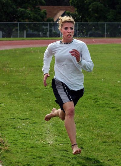 
Valley Christian School's Erica Hattamer runs through a drill in practice Monday.
 (Liz Kishimoto / The Spokesman-Review)