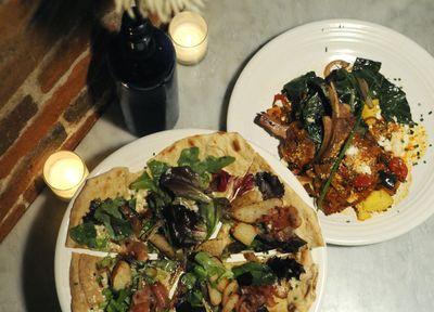 Mizuna, in downtown Spokane, offers a flatbread appetizer with a cracker-thin crust, bleu cheese, and topped with prosciutto and pears along with a honey-glazed Berkshire pork chop dinner entrée, right.  (Dan Pelle / The Spokesman-Review)
