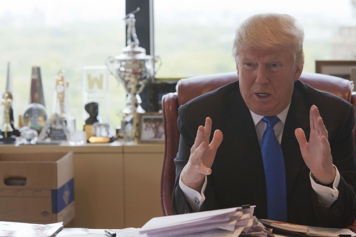 Republican presidential candidate Donald Trump gestures as he speaks during an interview with The Associated Press in his office at Trump Tower, Tuesday, May 10, 2016, in New York. (Mary Altaffer / Associated Press)