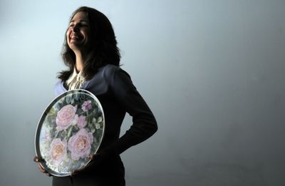 Sola Raynor talked about her recent paintings on porcelain at her home in Spokane. (Kathy Plonka / The Spokesman-Review)