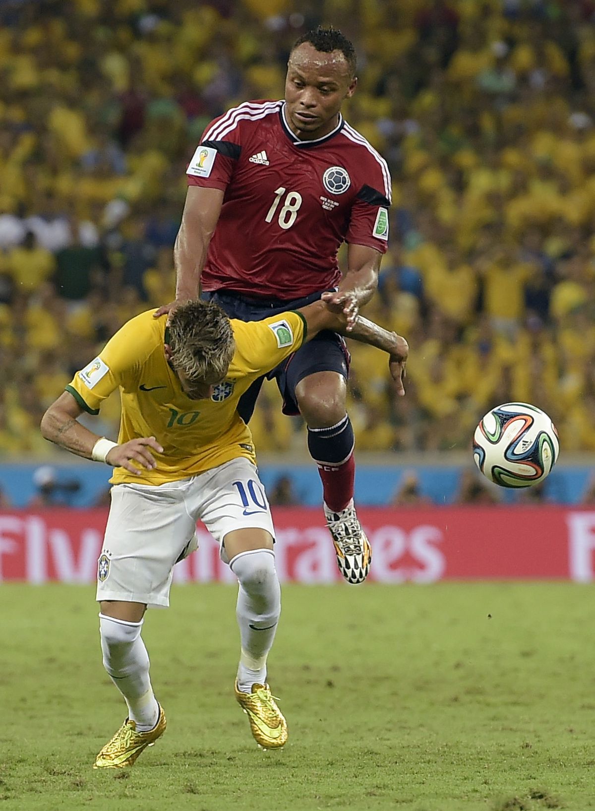 Brazil forward Neymar is fouled by Colombia defender Juan Camilo Zuniga. (AP)