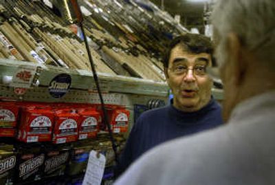 
Sam May reacts to White Elephant volunteer Jim Burris as they talk about steelhead fishing at the North Side White Elephant in Spokane on Wednesday. 