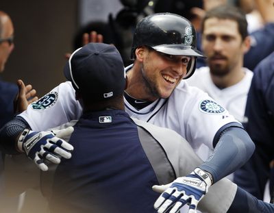 Alex Liddi was the center of attention for the Mariners after his fifth-inning grand slam. (Associated Press)
